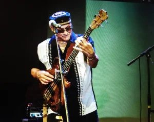 A man playing an electric guitar.